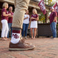 MSU Retro Stripe Casual socks worn standing on campus, showing maroon and gray banding with the interlocking MSU logo on white