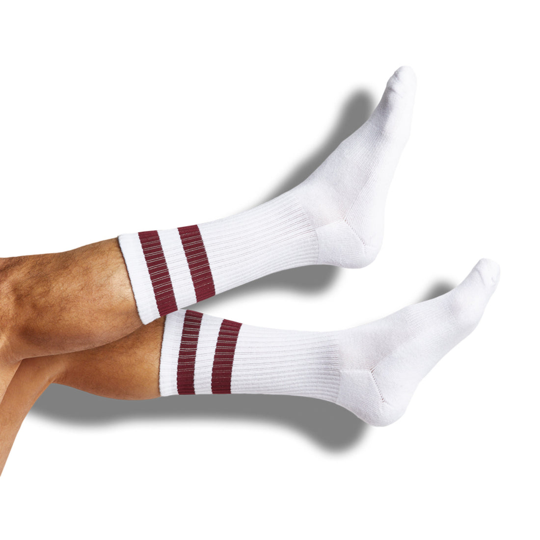 White casual athletic socks with retro maroon stripes on the leg