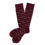 MSU Hail State Dress socks laid flat, showing repeating HAIL STATE text in white and gray on maroon