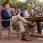 MSU Bulldawg Dress socks worn seated, showing the Bulldog mascot on maroon with gray colorblocking