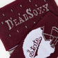 MSU Helmet Dress socks close welt and cuff detail, showing the State-script football helmet and fine striping on maroon