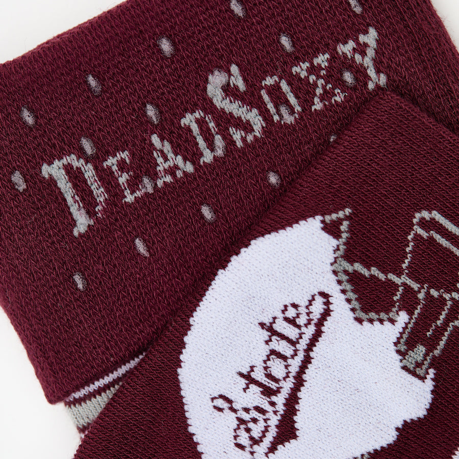 MSU Helmet Dress socks close welt and cuff detail, showing the State-script football helmet and fine striping on maroon