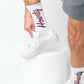 White Howdy Casual Socks with 'Howdy' text going up the leg in maroon. on mannequin.