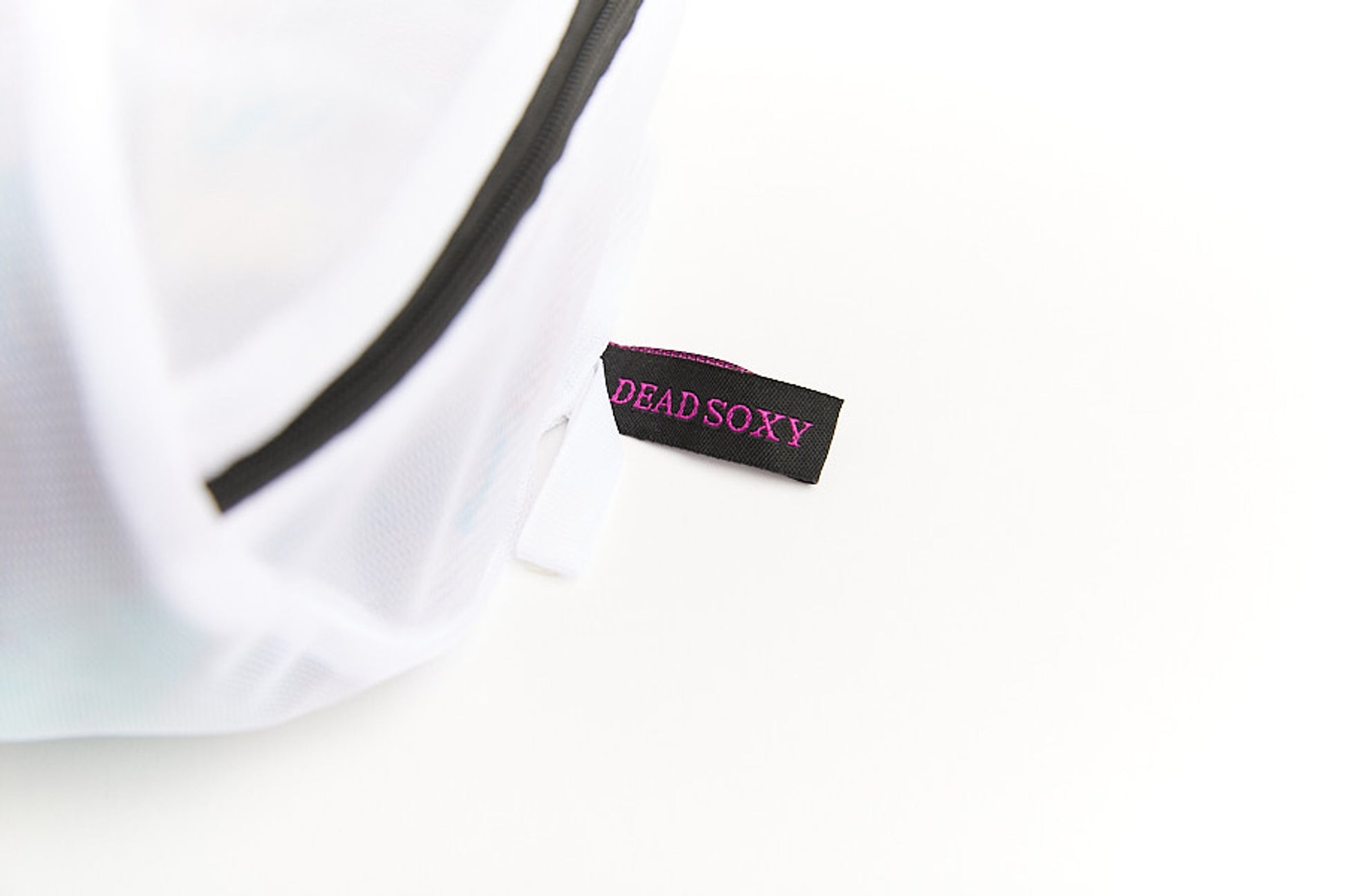 Close up of the zipper on DeadSoxy's brand new sock bag for laundry designed for hanging and easy use.