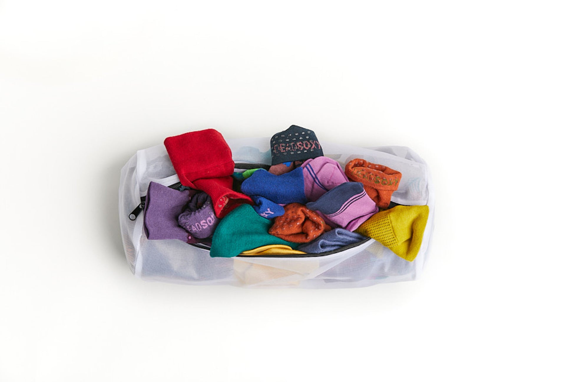New and Improved Mesh Sock Wash Bag full of DeadSoxy premium bamboo socks.