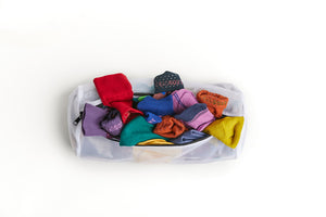 New and Improved Mesh Sock Wash Bag full of DeadSoxy premium bamboo socks.