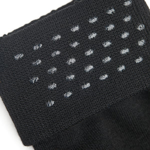 enlarged view of black sock welt with silicone dots