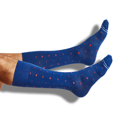 Navy and red dot dress socks with two powder blue accent stripes on the toe.
