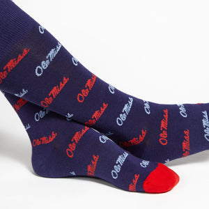 Licensed navy dress socks with the Ole Miss script logo in red and powder blue.