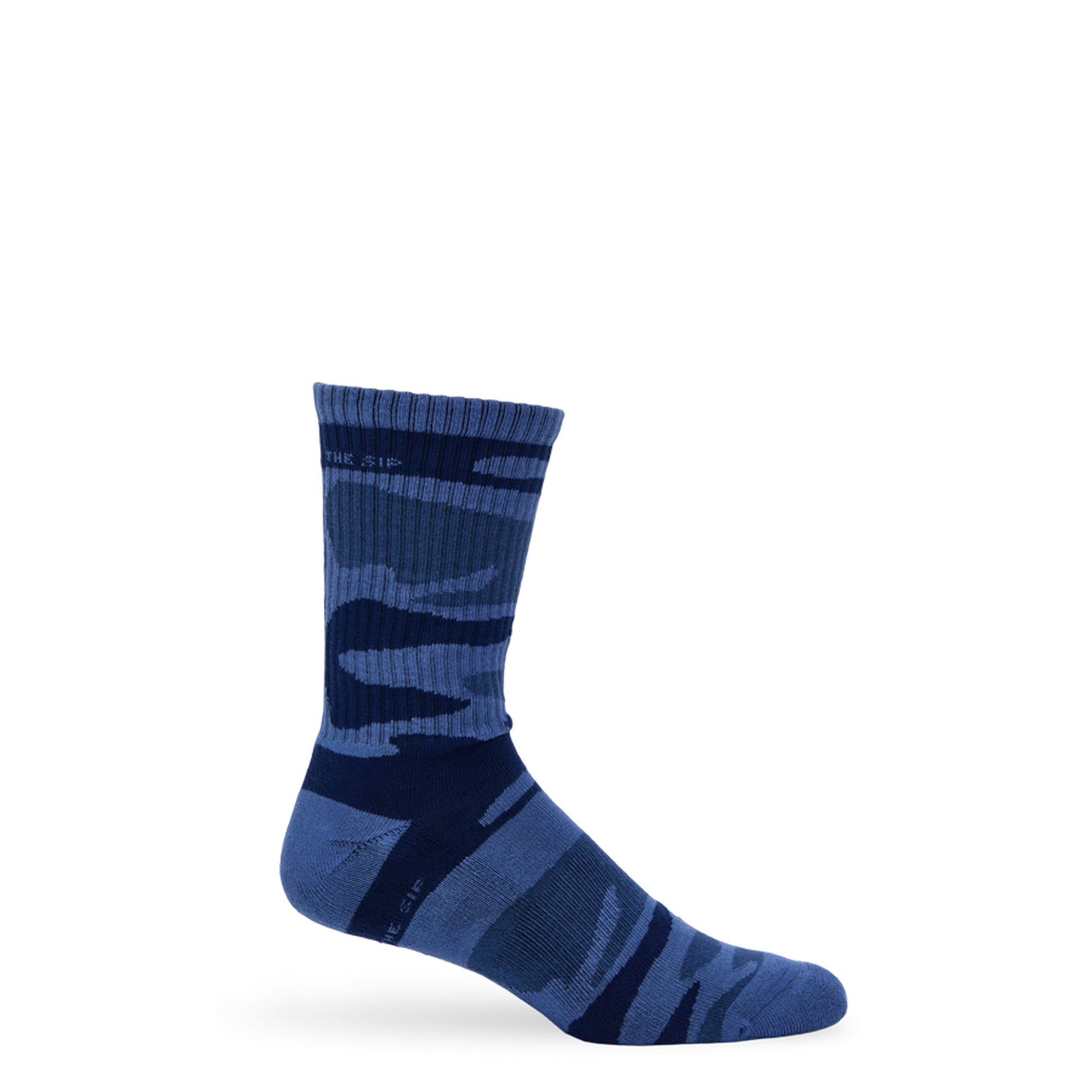 Side profile of Navy Sip Camo Crew Sock on foot, highlighting camo knit pattern and ribbed cuff.