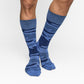 Navy blue camo dress socks with The Sip embedded in the design shown on male model