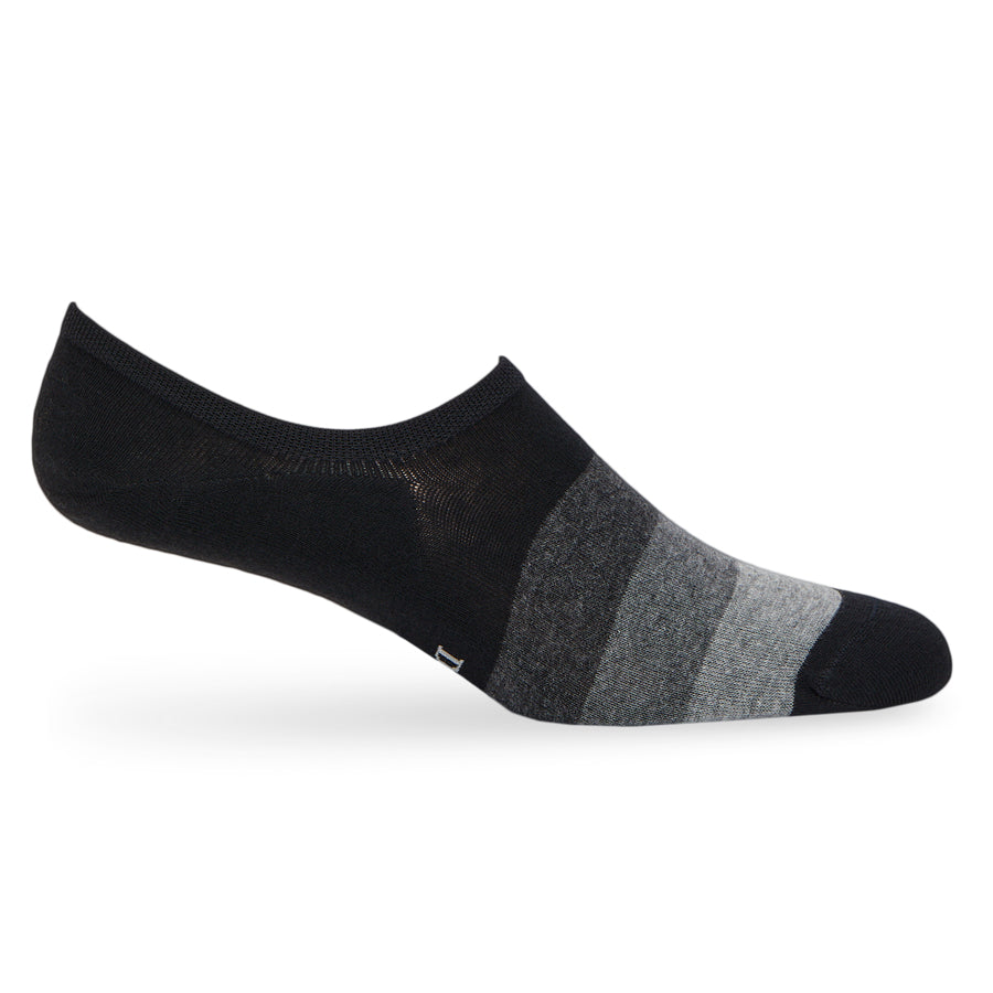 Jax no-show socks worn, showing the low-cut invisible fit in black and grey colour-block design