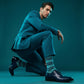 Noah navy and green stripe dress socks under neon lighting