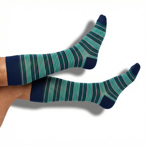 DeadSoxy Noah dress socks in navy and mint green stripe pattern worn on foot