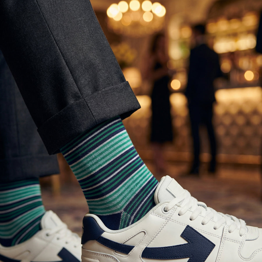 Noah mint green stripe dress socks styled with sneakers for casual wear