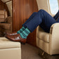 Noah mint stripe dress socks styled in travel setting