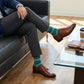 Noah dress socks worn in professional business meeting setting