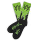 Not.Travis casual collab socks with black base and green drip shown laid out flat.