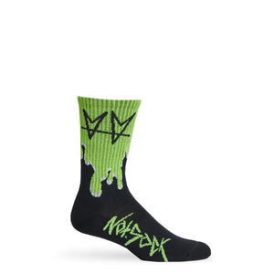 Not.Travis casual collab socks with black base and green drip shown on mannequin.