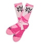 Not.Travis casual collab socks with pink geometric design shown laid out flat.
