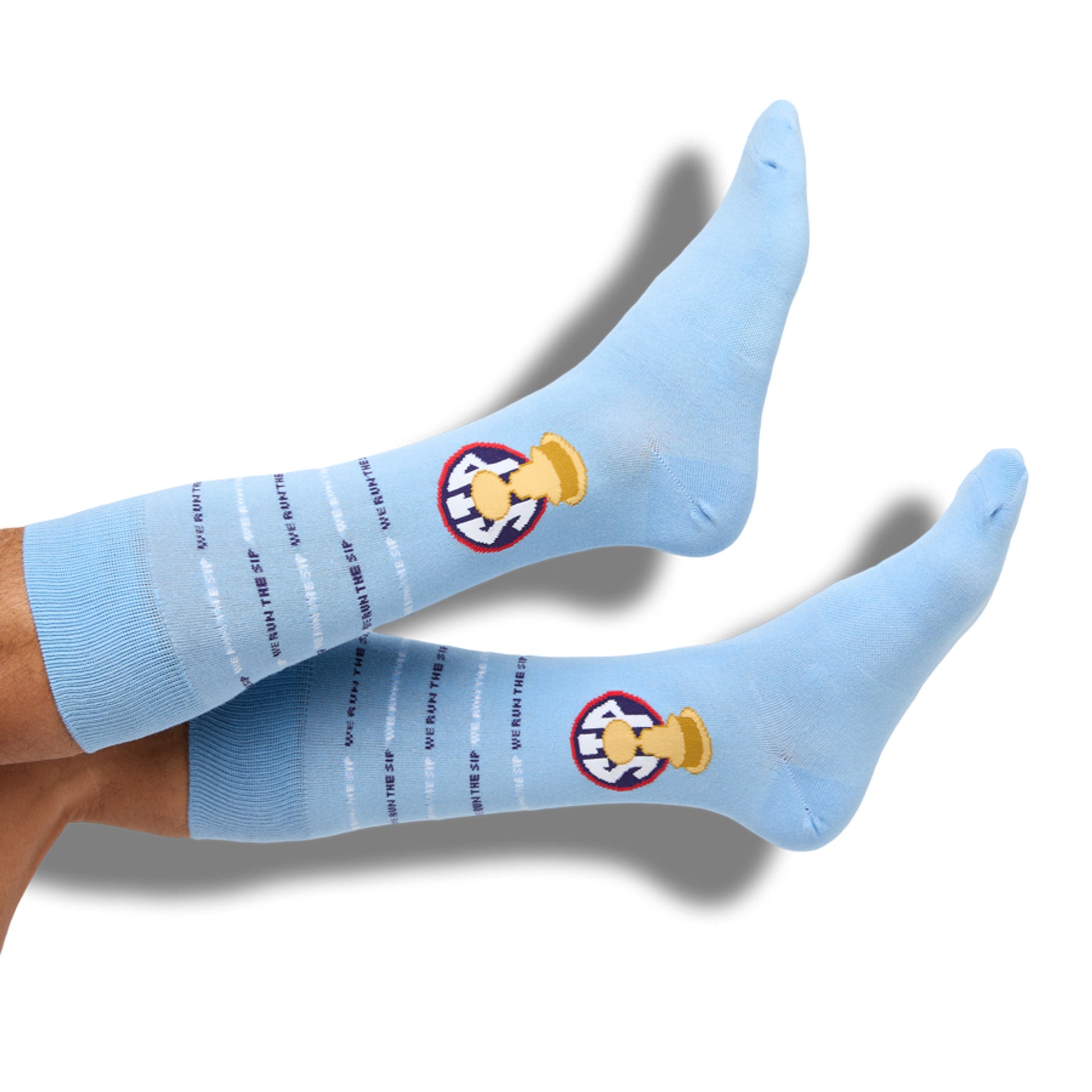 Powder SIP dress socks with the Egg Bowl trophy on the ankle shown on legs.