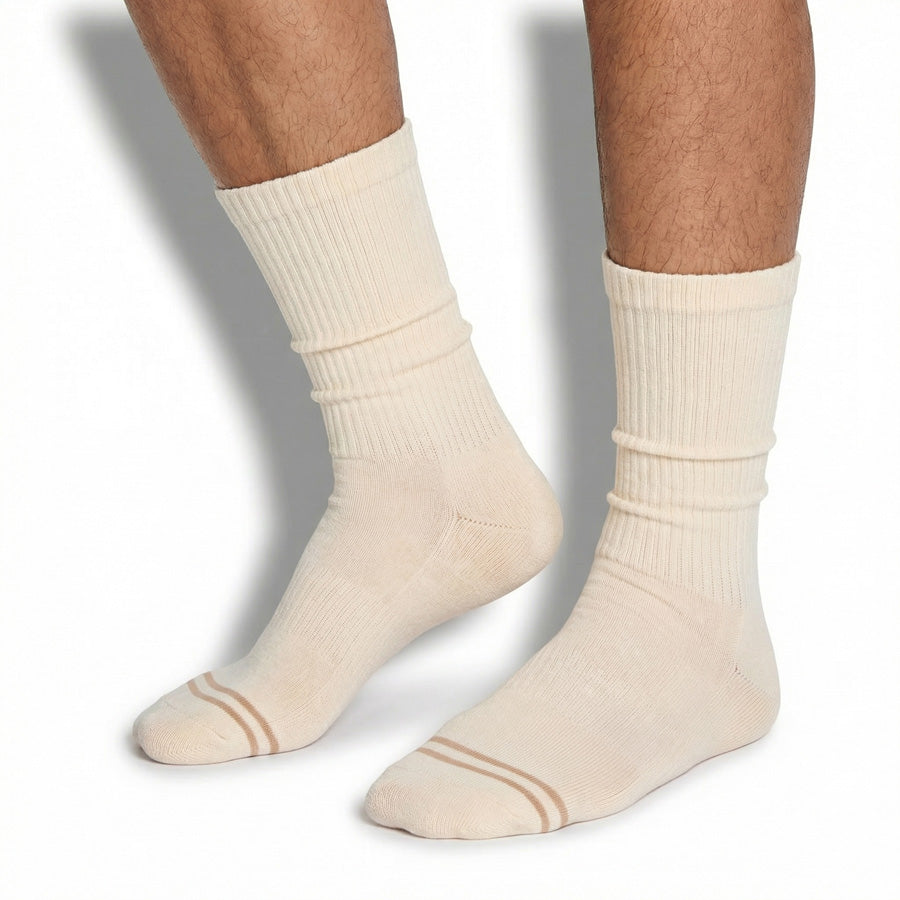 DeadSoxy Off-White Casual Crew Socks worn on foot showing clean cream colorway with grey double-stripe toe accent