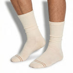 DeadSoxy Off-White Casual Crew Socks worn on foot showing clean cream colorway with grey double-stripe toe accent