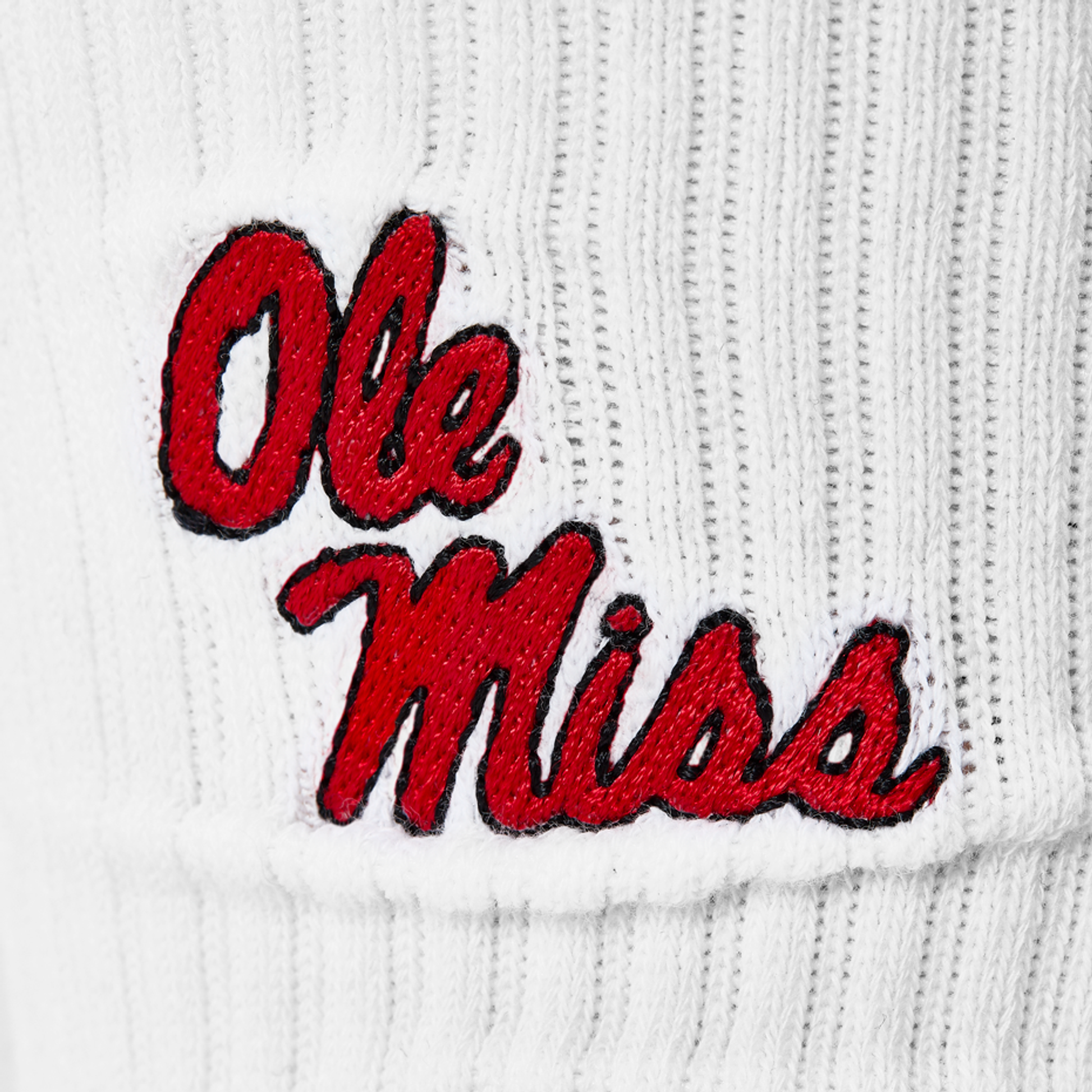 White Crew Socks with Ole Miss embroider on the calf in red.