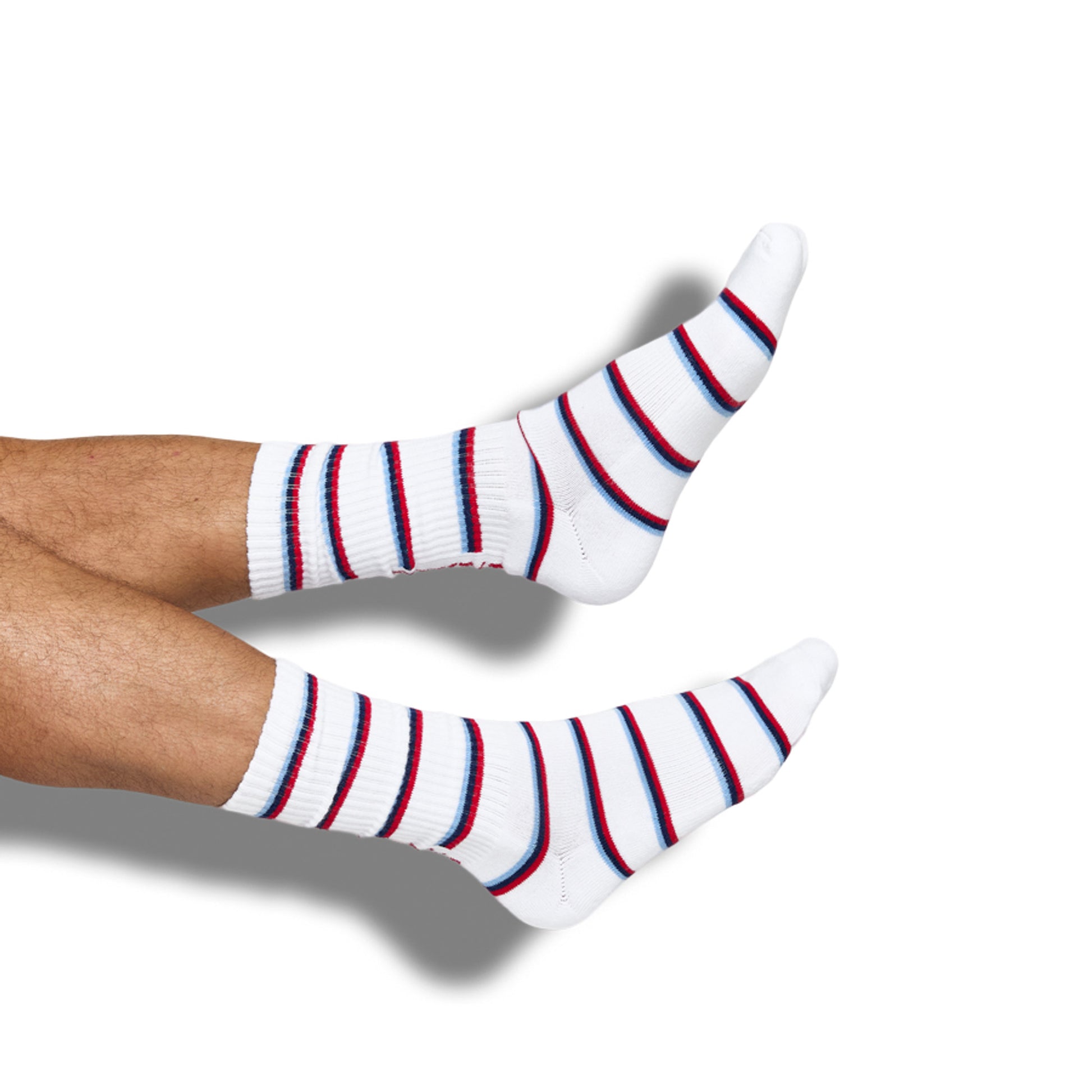 powder blue dress socks with dots and UM on the ankle