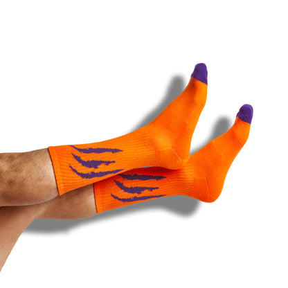 orange casual socks with purple scratch marks on the leg shown on legs