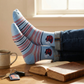 Lifestyle shot of Powder Helmet Dress Socks worn with dress shoes