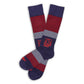 Party in the Sip licensed navy dress socks with stripes with the Ole Miss script on the toe laid flat.