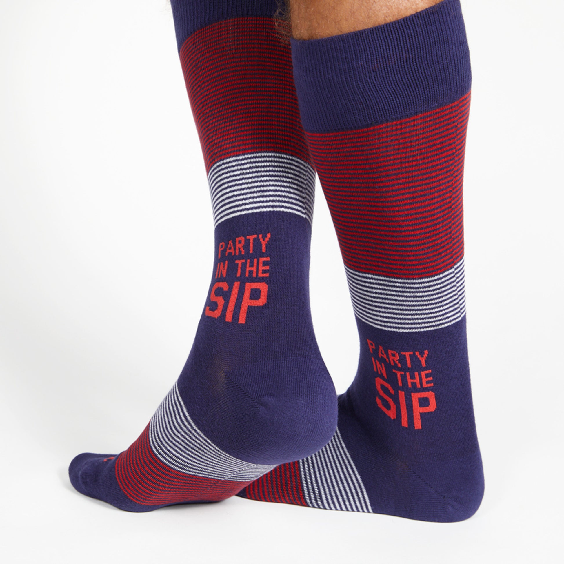 Party in the Sip on the ankle of these stripe dress socks in navy, red, and white.
