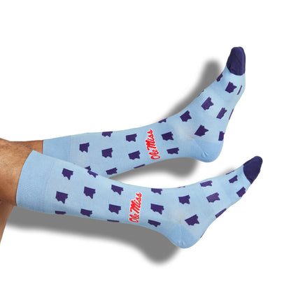 Licensed powder blue dress socks with the state outline in navy and the Ole Miss script logo in red on the ankle.