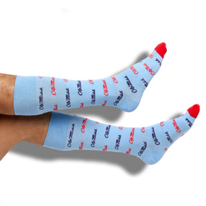 Powder Script Ole Miss Dress Socks with TrueStay‚Ñ¢ technology and seamless toe on legs.