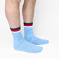 white crew socks on male legs sitting