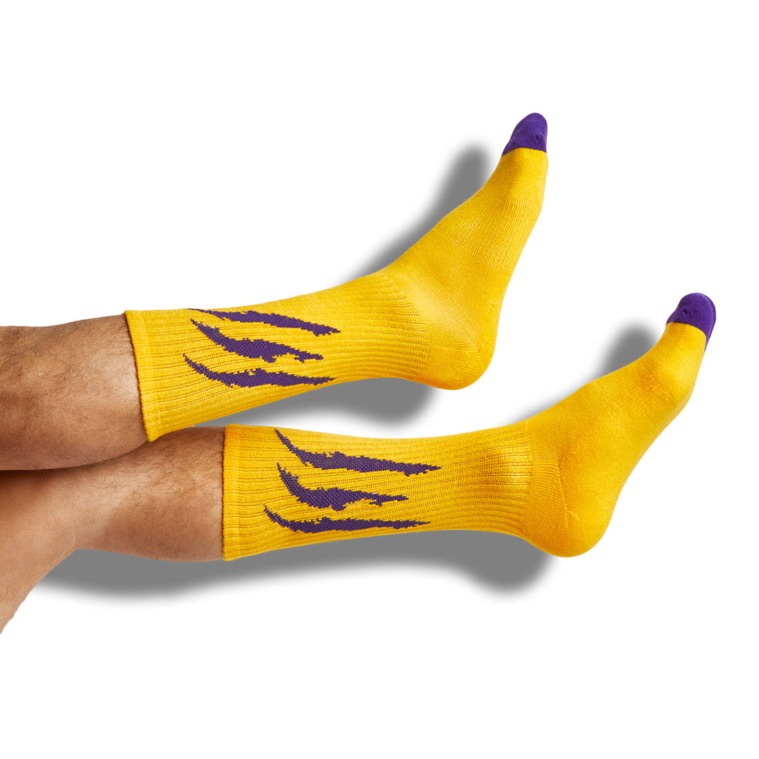 gold  casual socks with a purple scratch design on the leg.