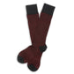 Black and red birdseye dress socks laid out flat