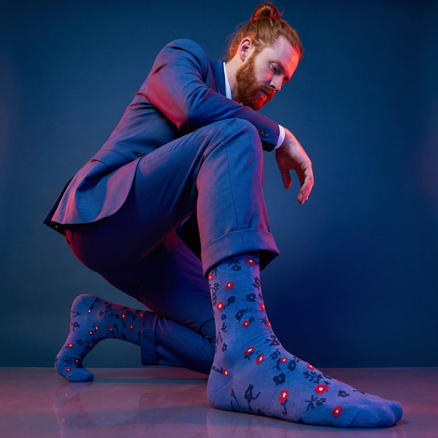 Richie blue floral dress socks under neon lighting