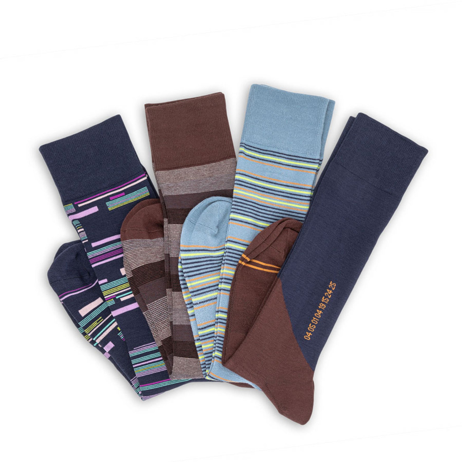 4 pairs of premium dress socks with mixed designs laid flat in a v shape