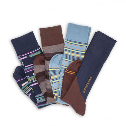4 pairs of premium dress socks with mixed designs laid flat in a v shape