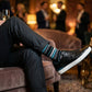 Scott black and teal stripe dress socks styled with sneakers