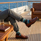 Scott teal stripe dress socks styled in travel setting