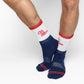 Navy and White 50/50 design with Ole Miss script on the side of the calf shown on male legs standing crossed
