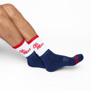 Navy and White 50/50 design with Ole Miss script on the side of the calf shown on male legs sitting crossed