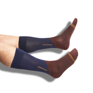 Navy Blue and rich Brown dress socks with tan accents and numbers on tan on legs
