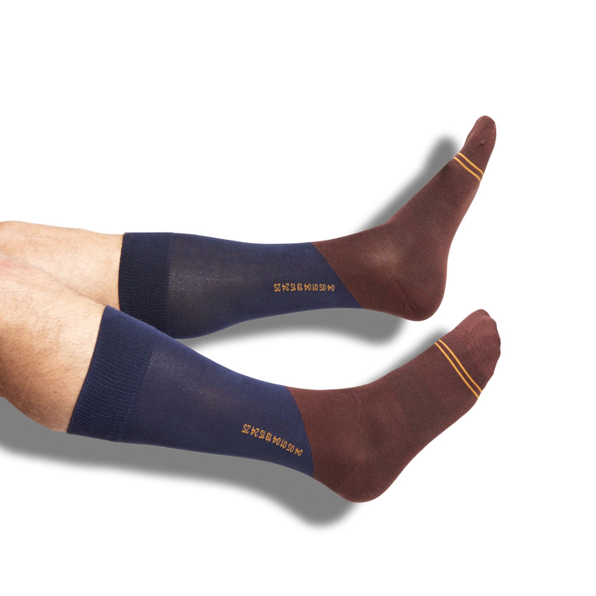one pair of navy blue and brown dress socks with numbers down the calf on legs.