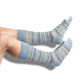 light blue stripe dress socks with accent stripes in grey orange and blue shown on legs