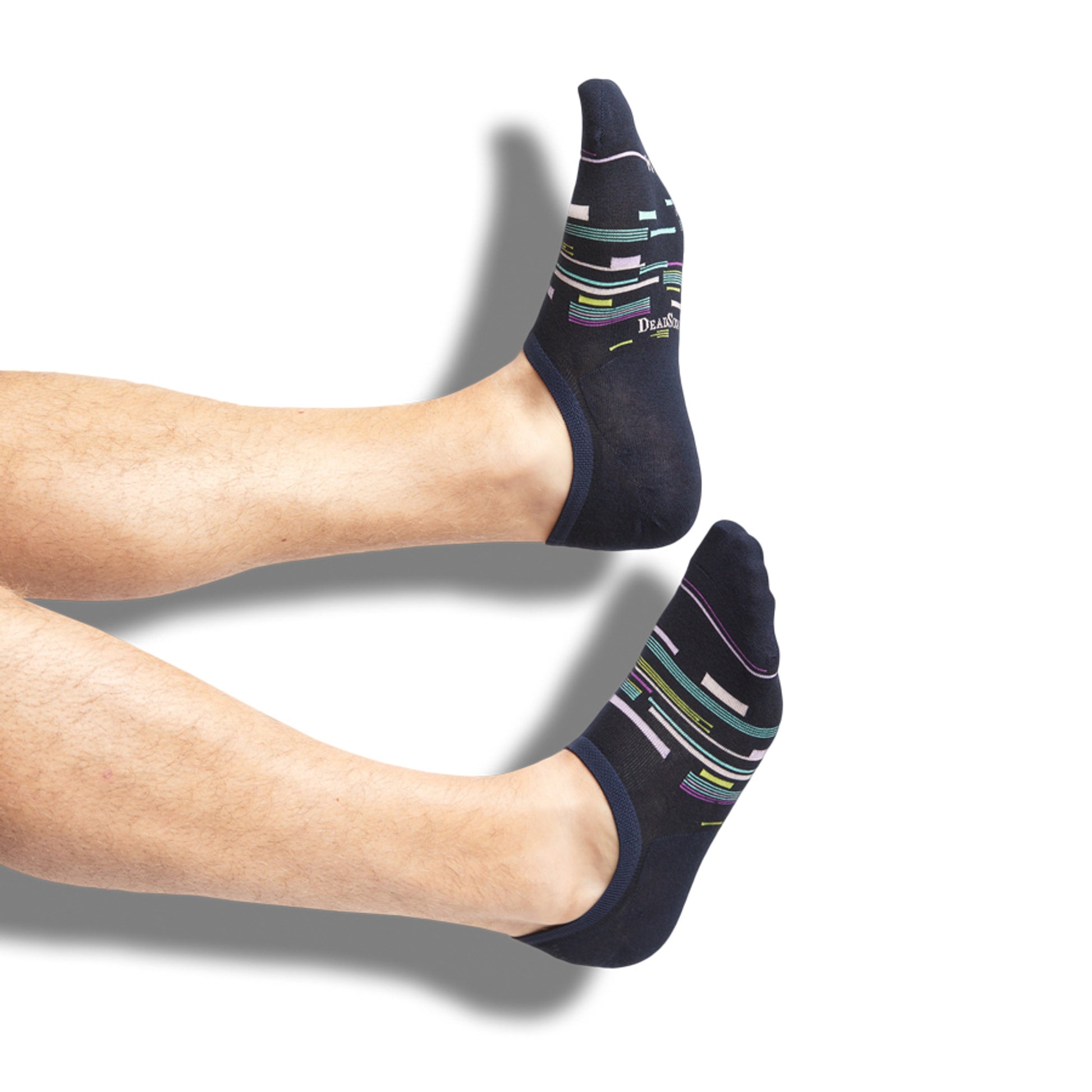 Navy no show socks with a patchwork design on legs.