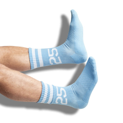 Powder blue casual socks with two retro stripes and the number 25 on the leg